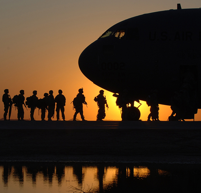 military personnel boarding an aircraft